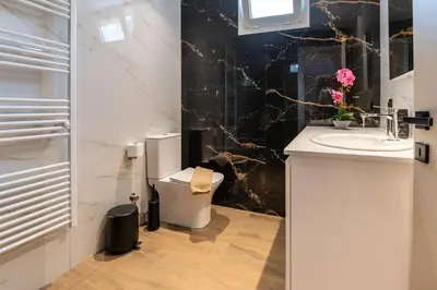 a bathroom with a sink and a toilet at Mystrali II in Galatás