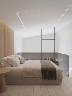a white bedroom with a large bed and a table at Okeanis Elysium in Daratso