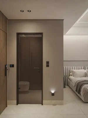 a bedroom with a bed and a door with a toilet at Okeanis Elysium in Daratso