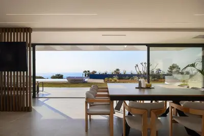 a dining room with a table and chairs at Orus Villa in Chania Town