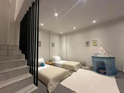 a room with two beds and a fireplace at Lavender Loft in Chania Town