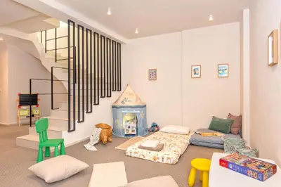 a living room with a bed and a fireplace at Lavender Loft in Chania Town