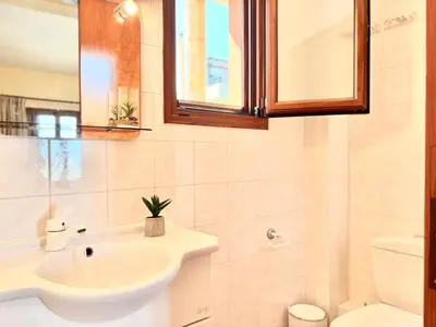 a bathroom with a sink and a toilet at Casa Eygenia in Galatás