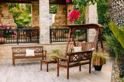 a couple of benches sitting on a patio at Casa Eygenia in Galatás