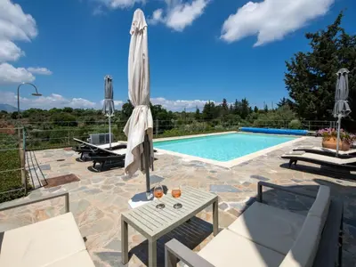 a villa with a swimming pool and a patio at Holiday Home Villa vacanze Agave Creta con piscina privata by Interhome in Litsárdha