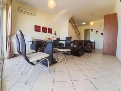 a living room with chairs and a table at Apartment Charmante Ferienwohnung Rubini 2 by Interhome in Agia Marina Nea Kydonias