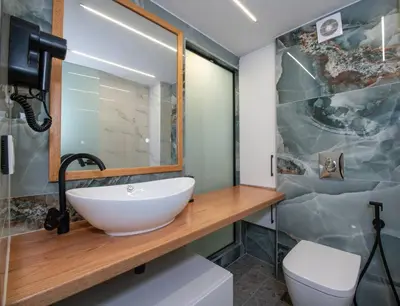 a bathroom with a sink and a toilet at Chania Luxury City Retreat , Hammam & outdoor Jacuzzi in Chania Town
