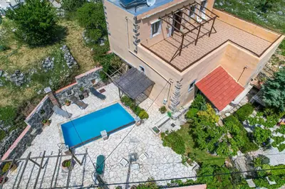 an overhead view of a house with a swimming pool at Stone-Built Traditional Villa with Pool in Sfakia in Ímbros