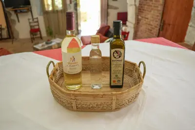 three bottles of wine in a basket on a table at Stone-Built Traditional Villa with Pool in Sfakia in Ímbros