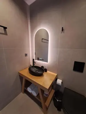 a bathroom with a sink and a mirror at Castella Luxe in Loutro