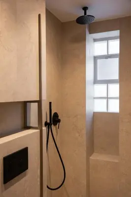 a shower in a bathroom with a window at Raviewha Luxury Apartments 3 in Ravdhoúkha