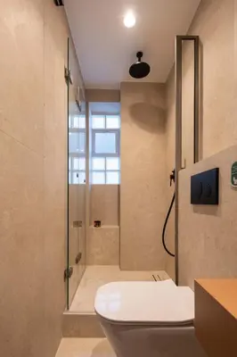a bathroom with a shower and a toilet and a sink at Raviewha Luxury Apartments 3 in Ravdhoúkha