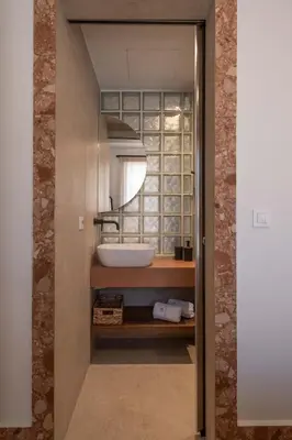 a bathroom with a sink and a mirror at Raviewha Luxury Apartments 3 in Ravdhoúkha