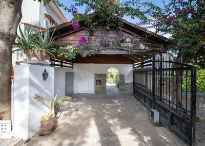an entrance to a house with flowers on it at Esperado Gardens Maleme in Maleme