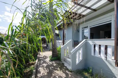 a porch of a house with plants at Esperado Gardens Maleme in Maleme