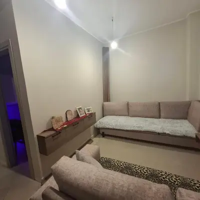a living room with a couch and a bed at Αγίου Φανουρίου 5 γάλατα Χανιά Κρήτης in Galatás