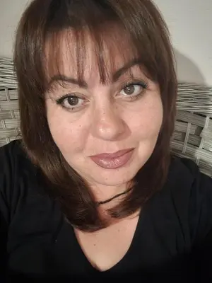 a woman with brown hair is smiling at the camera at Αγίου Φανουρίου 5 γάλατα Χανιά Κρήτης in Galatás