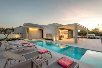 an image of a house with a swimming pool at Deux Olives Luxury Villa in Maleme