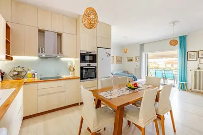 a kitchen and dining room with a table and chairs at Downtown house with seaview near to the beach in Chania Town