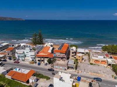 an aerial view of a town next to the ocean at SeaREN Apartment in Stalos