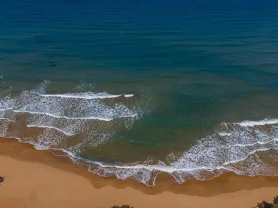 an overhead view of the ocean and the beach at SeaREN Apartment in Stalos