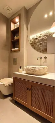 a bathroom with a sink and a toilet and a mirror at HOLM Ilex & Quercus apartments in Chania Town