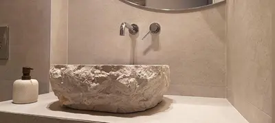 a stone sink in a bathroom with a shower at HOLM Ilex & Quercus apartments in Chania Town