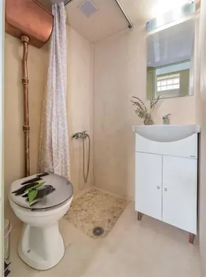 a bathroom with a toilet and a sink at Rea Studio 2 in Chania Town