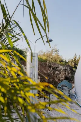 a street light in front of a fence at Olive Dome, Luxury Glamping Dome in Crete in Gavalochori