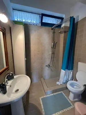 a bathroom with a sink and a shower and a toilet at Casa Antica