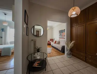 a living room with a couch and a table at Sunny Nest, Stylish & Bright Urban Retreat in Chania Town