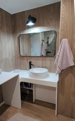 a bathroom with a sink and a mirror at Modern Central Apartment - 400m to Beach in Kissamos