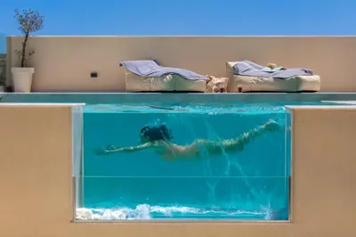 a mermaid swimming in a large aquarium at Villa Metochi with Private Pool in Palio Gerani