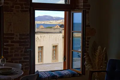 a view of the ocean from a window at Vecia Abasia - The Old Abbey in Chania Town