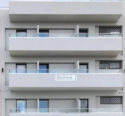 a white apartment building with the name stella at stelisia2 in Chania Town