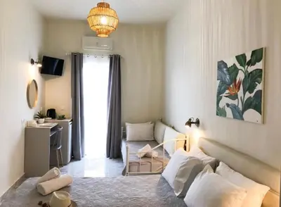 a living room with a couch and a table at stelisia2 in Chania Town
