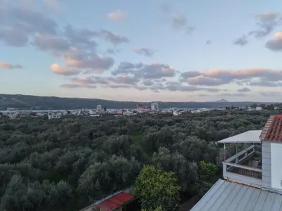 a view of a city from the roof of a building at Komvos Apartment in Souda