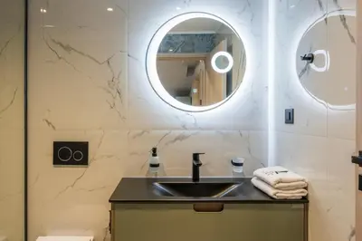 a bathroom with a sink and a mirror at Armdin Seaview Villa 2 in Módhion