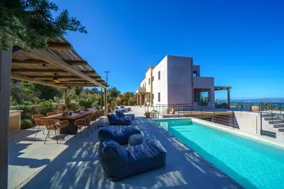 a villa with a swimming pool and a house at EAST VILLA by CYAMES in Gavalochori