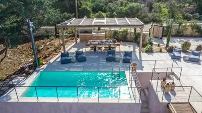an overhead view of a pool with a table and chairs at EAST VILLA by CYAMES in Gavalochori