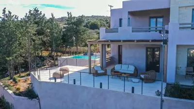 a house with a balcony with a swimming pool at EAST VILLA by CYAMES in Gavalochori