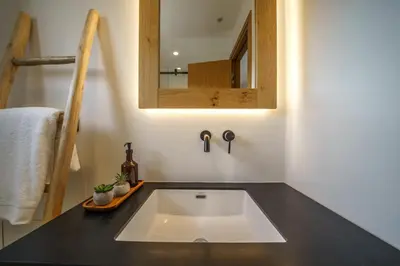 a bathroom with a sink and a mirror at EAST VILLA by CYAMES in Gavalochori