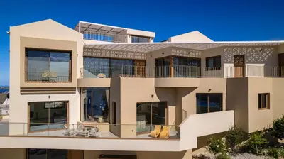 an exterior view of a building with large windows at BelSodi - 3bedroom sea views and heated pool in Chania Town