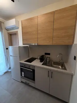 a kitchen with a sink and a refrigerator at NESTIVA - Apartment in the Center of Chania in Chania Town