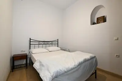a bedroom with a bed with a black headboard at Chania Hillside 2BD Home - Nature & Comfort by ΜΡS