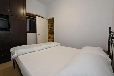a bedroom with two white beds and a closet at Chania Hillside 2BD Home - Nature & Comfort by ΜΡS
