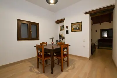a dining room with a table and chairs at Chania Hillside 2BD Home - Nature & Comfort by ΜΡS