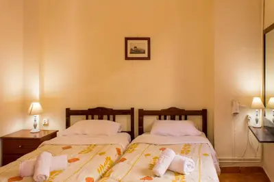 two beds sitting next to each other in a room at Iason Studios in Chania Town