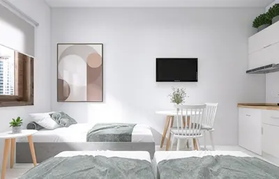 a bedroom with a bed and a table and a tv at Katerina Sea Apartments in Chania Town