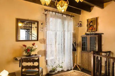 a room with a white curtain and a window at Villa Margot in Chania Town